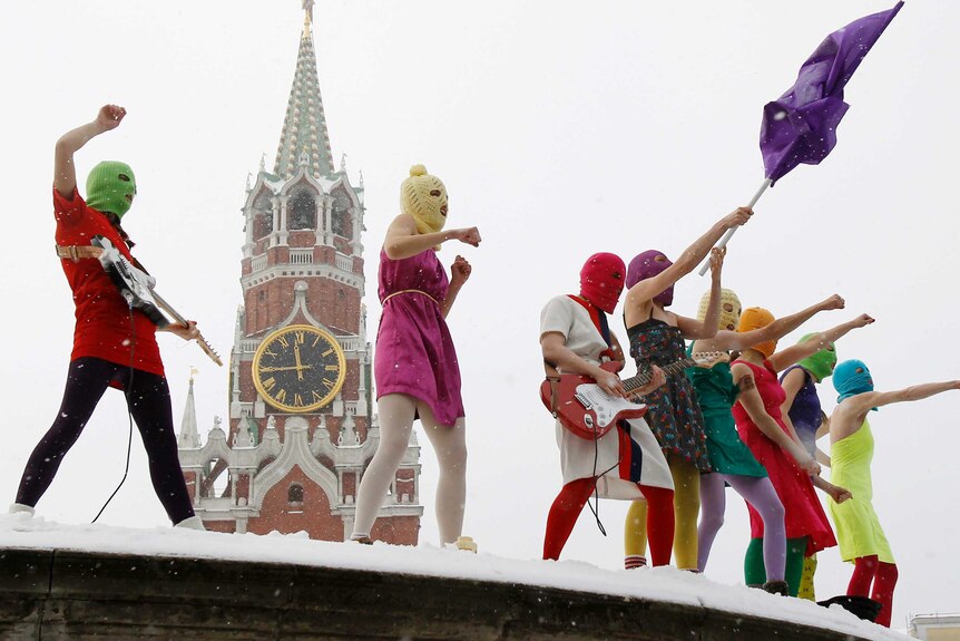 Members of the Russian radical feminist group 'Pussy Riot' sing in the Red Square