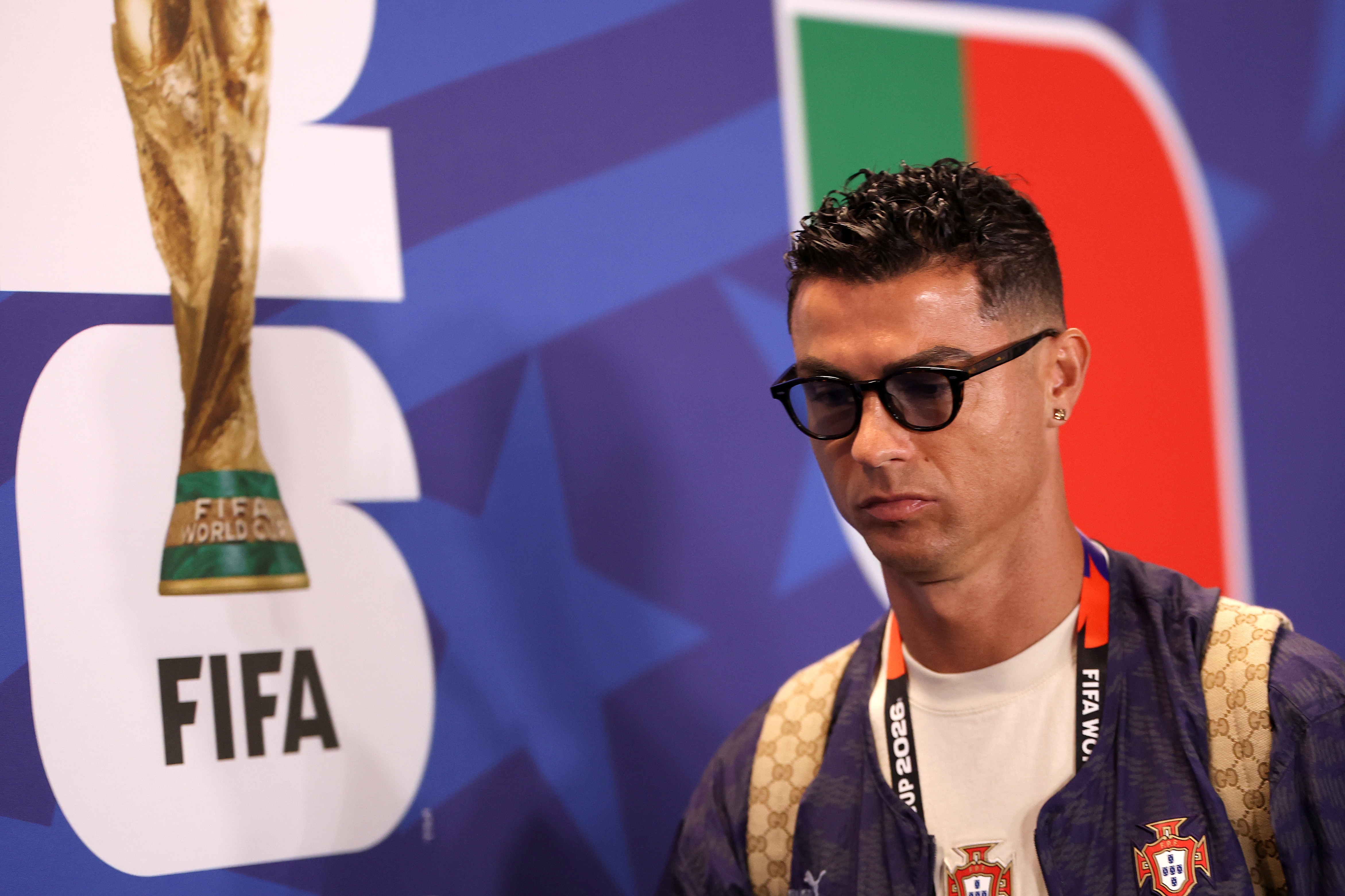 Cristiano Ronaldo is wearing sunglasses and casual clothes as he arrives for a match