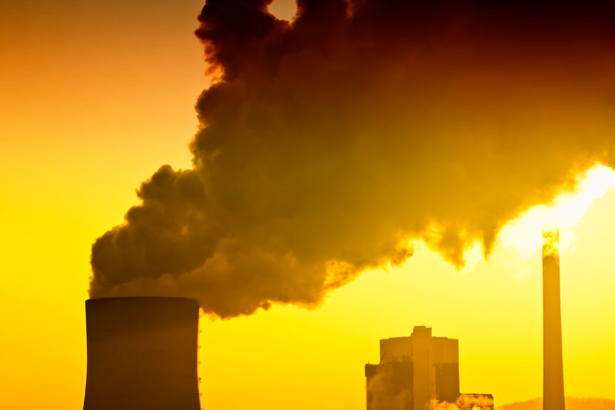 Pollution from a power station at sunset