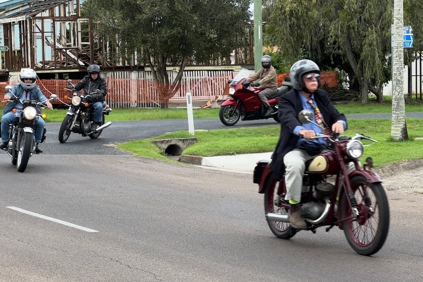 men ride motorcycles