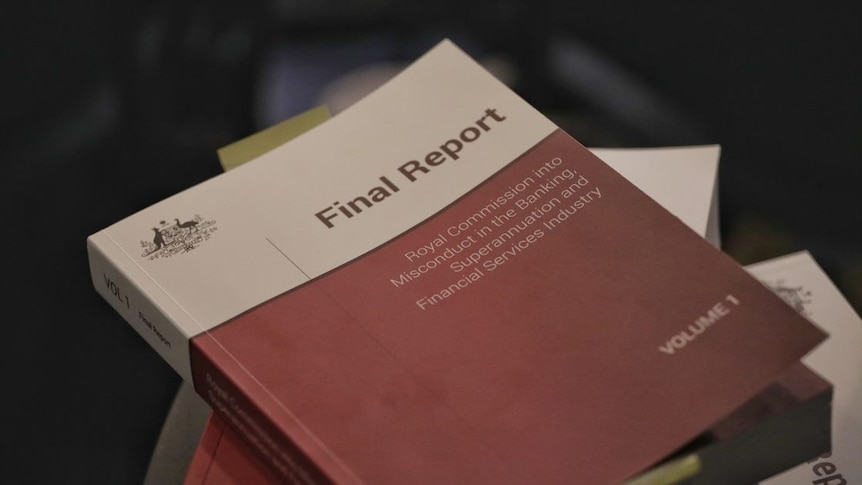 Three volumes of the banking royal commission final report stacked on top of each other