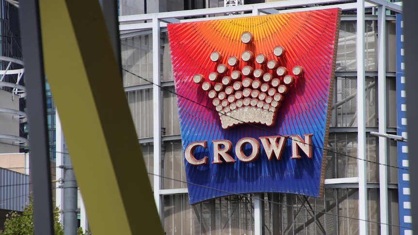 The Crown casino logo is emblazoned on a colourful sign.