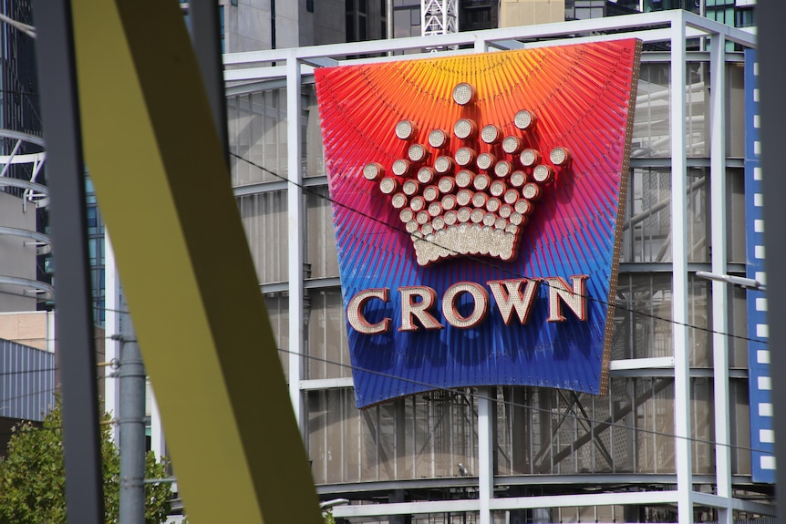 The Crown casino logo is emblazoned on a colourful sign.