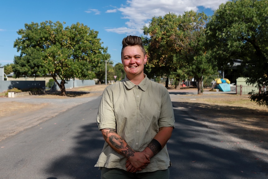 Woman stands on quiet country street