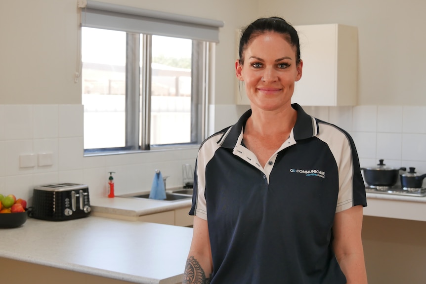  Manager of Hedland Breathing Space stands in space kitchen. 