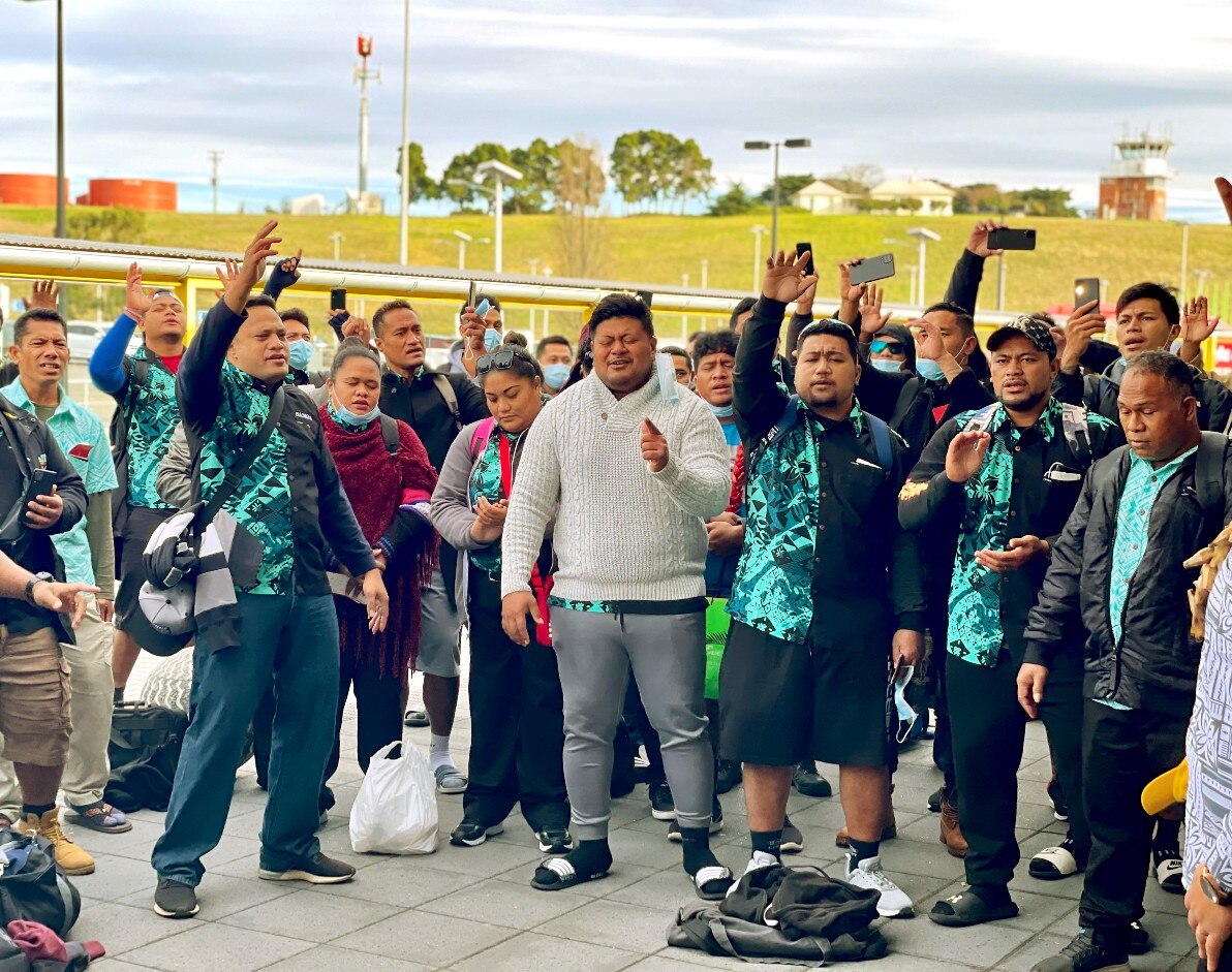A group of Samoans sing at Hobart Airport