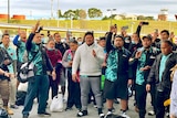 A group of Samoans sing at Hobart Airport