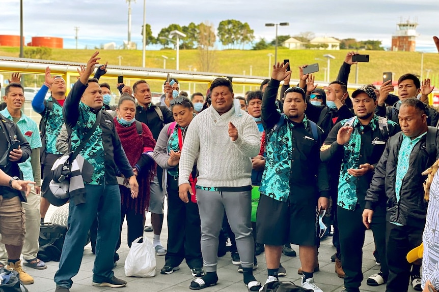 A group of Samoans sing at Hobart Airport