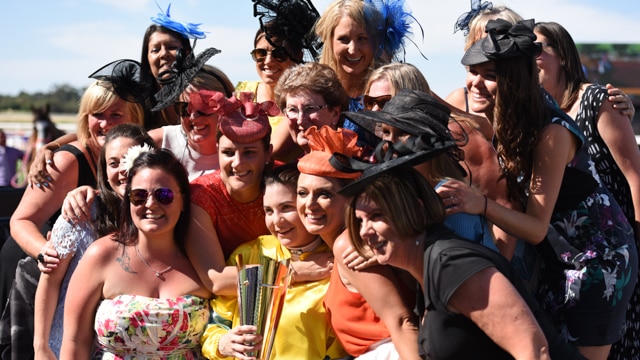Nineteen of Man Booker's twenty-three female co-owners celebrate his win at Ascot.