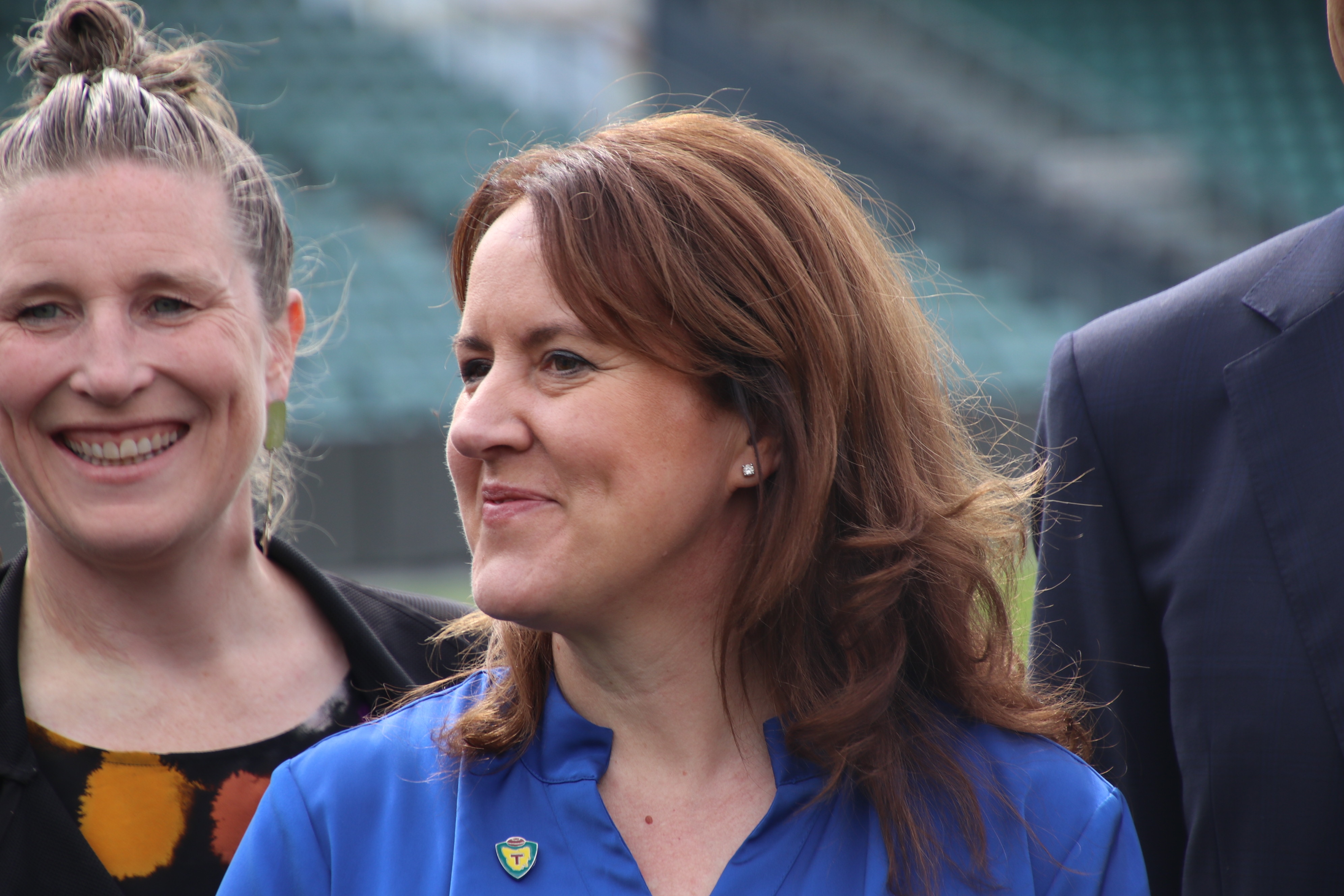 Alicia Leis (front) and Kath McCann (behind) at announcement of the inaugural board for AFL Tasmania team, photographed with other board members at York Park, Launceston September 2023