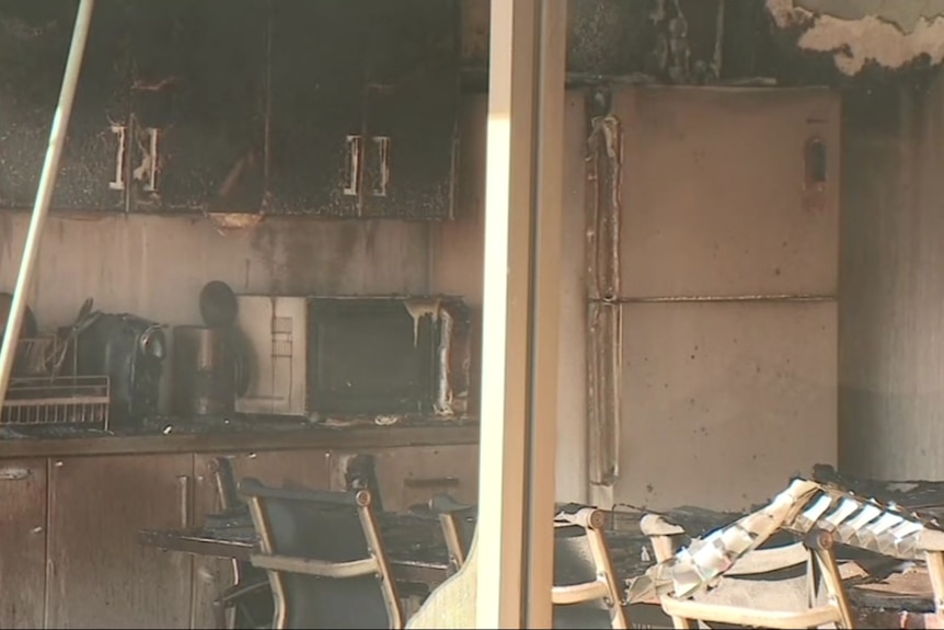 Burnt chairs, tables and other furniture and equipment inside the bakery.