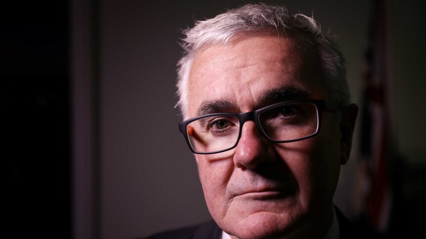 Independent MP Andrew Wilkie looks at the camera.