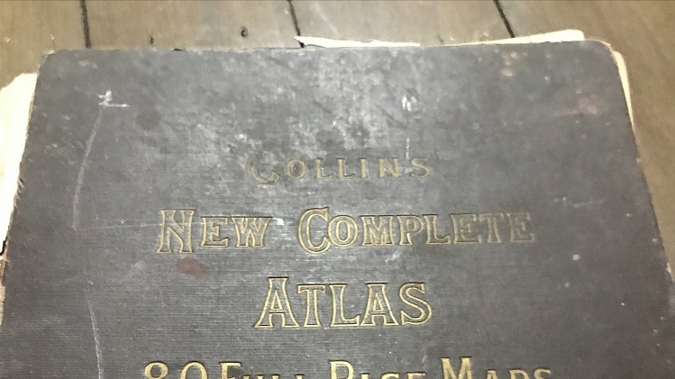 The front cover of an old Atlas, complete with Gazetteer