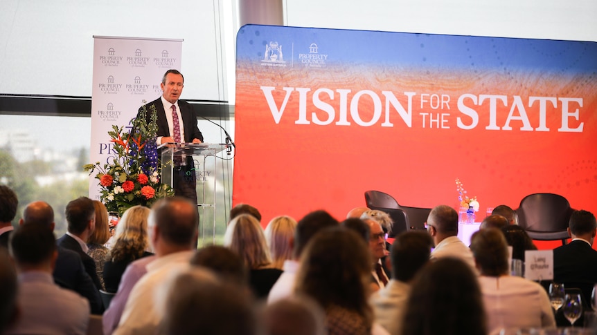 WA premier Mark McGowan speaks at a lectern next to a sign that says 'Vision for the State'