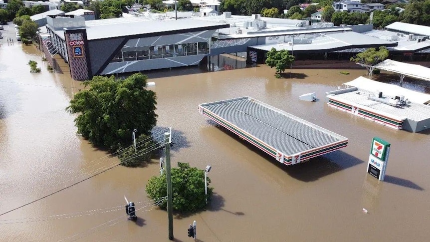 An aerial view of houses submerged in water.