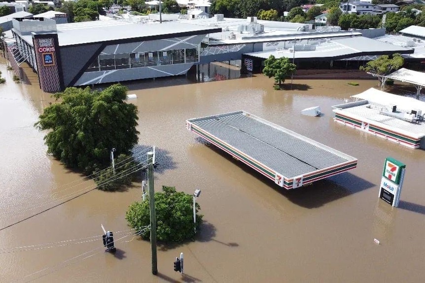 An aerial view of houses submerged in water.