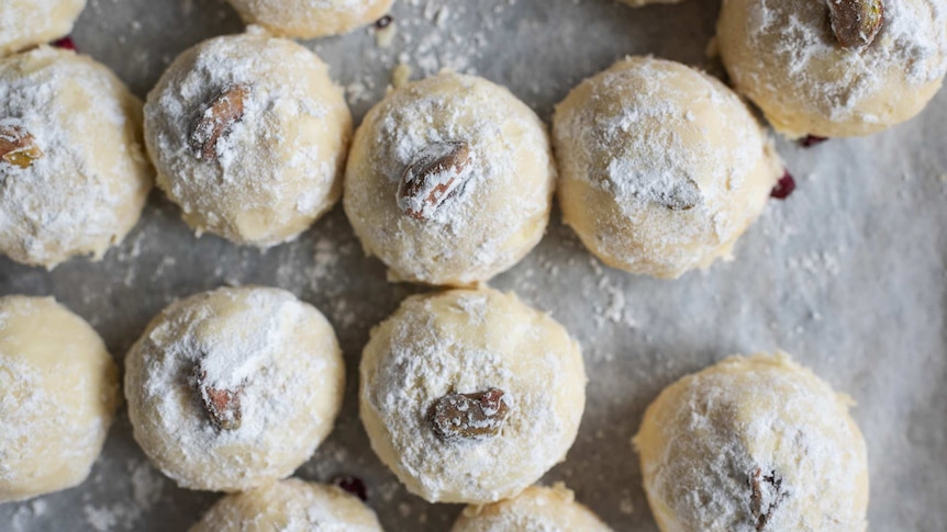 A close up of several almond and pistachio shortbread with rosewater made with Thalia Ho recipe