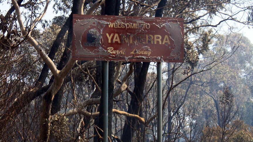 The scorched sign at the entrance to Yanderra in the Southern Highlands.