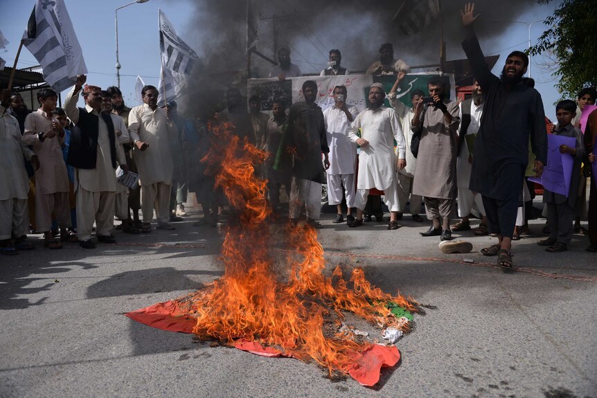 Pakistani separatists burn an Indian flag during demonstrations in Islamabad