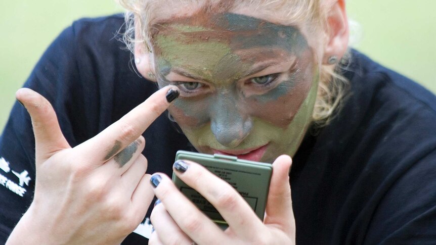 Lauren Jackson puts the finishing touches on her war paint