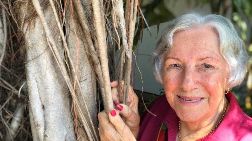 Carol Furlan standing next to a banyan tree in Darwin.