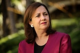 Headshot of Queensland Premier Annastacia Palaszczuk listening at media conference.