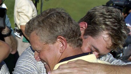 Colin Montgomerie is hugged by Lee Westwood after sinking the winning putt