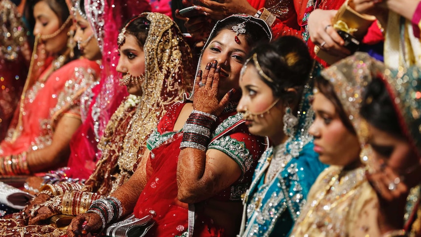 Muslim brides wait for the start of their mass marriage ceremony in India May 11, 2014.