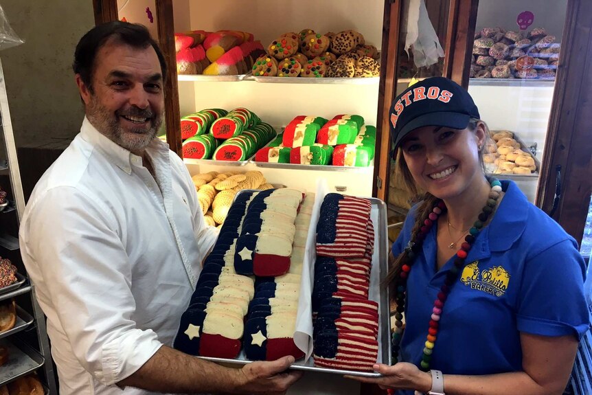 Owner Kirk Michaelis and his daughter Meagan in her astros cap with american and texas flag cookies