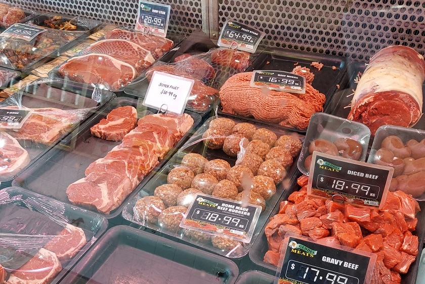 Trays of steak, meatballs, diced beef, mince and roast in a butcher's window.