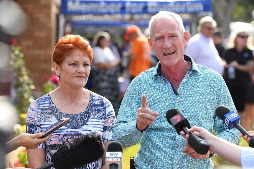 One Nation Senator Pauline Hanson and her Queensland party leader Steve Dickson speak to the media.