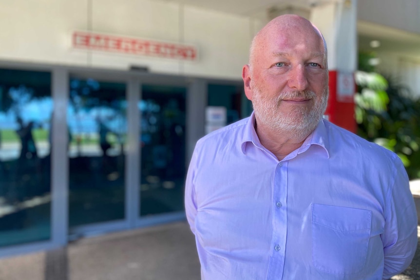 Dr Don Mackie stands outside the Cairns Hospital in Far North Queensland.