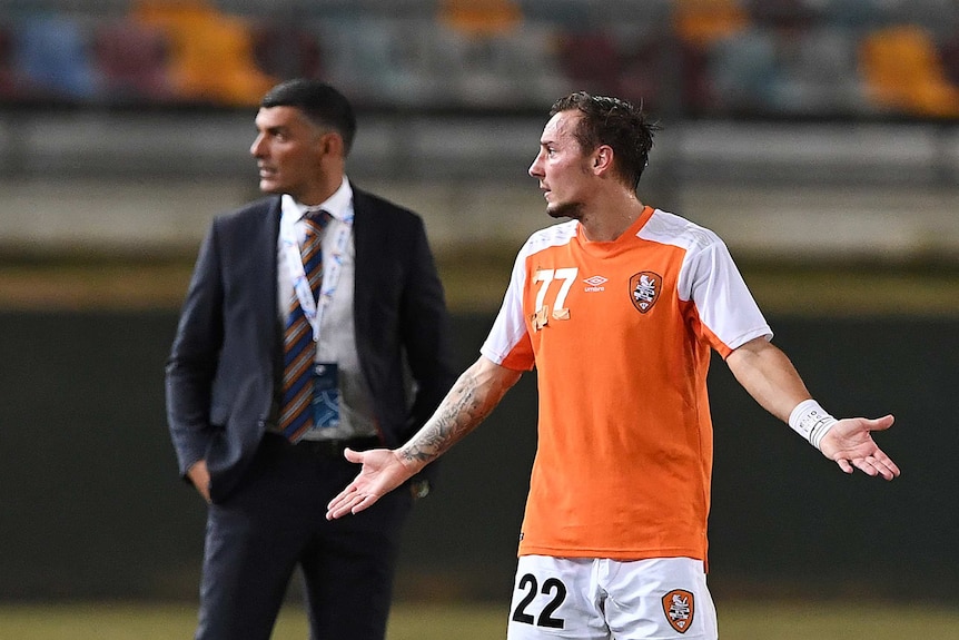 Brisbane Roar's Eric Bautheac on the sidelines with taped numbers