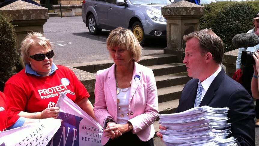 Opposition Leader Will Hodgman was presented with the petition by health unions.