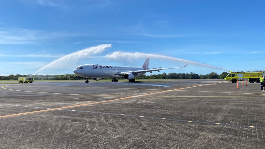 A Qantas plane gets a water gun salute