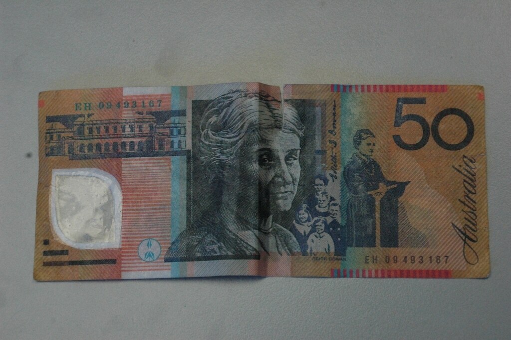 Woman charged over counterfeit notes - ABC News