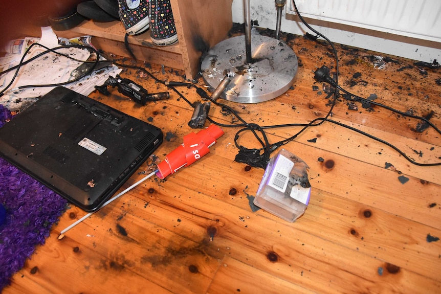 A damaged laptop in a Melbourne bedroom after it exploded after being left on continuous charge.