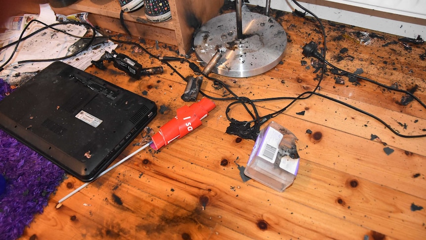 A damaged laptop in a Melbourne bedroom after it exploded after being left on continuous charge.