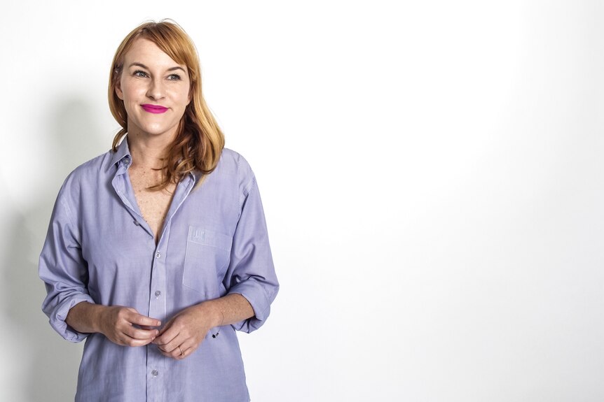 Actress and playwright Kate Mulvany stands against a white background.