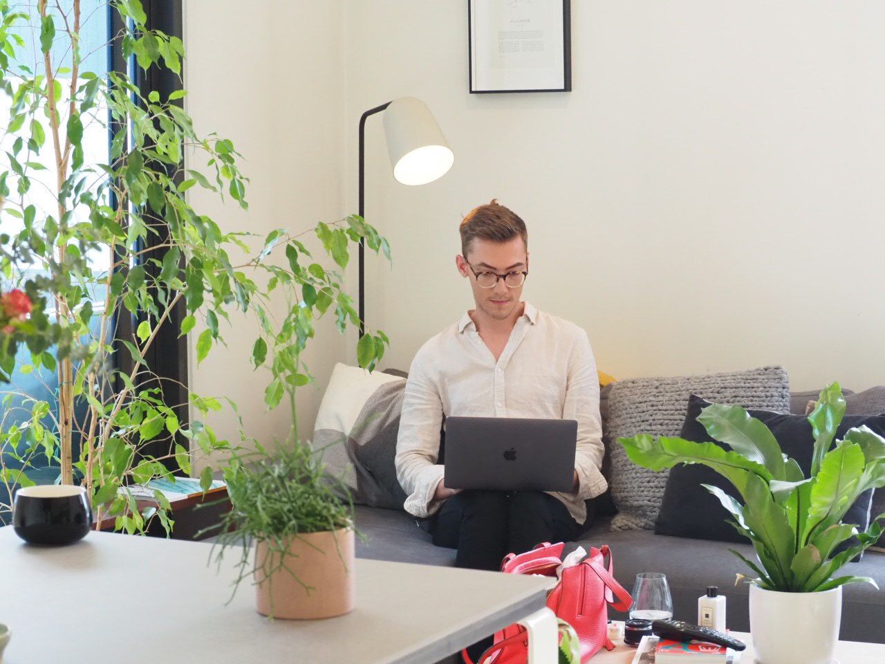 Glenn Turnham uses his laptop in his living room.