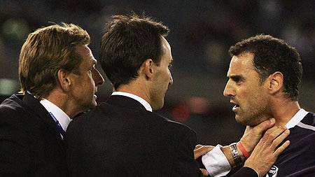 Costly incident ... John Kosmina grabs the throat of Kevin Muscat at Docklands last Sunday