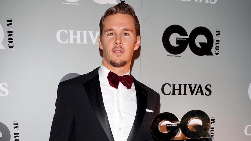 Ryan Kwanten poses with his 2010 GQ 'Man Of The Year' award