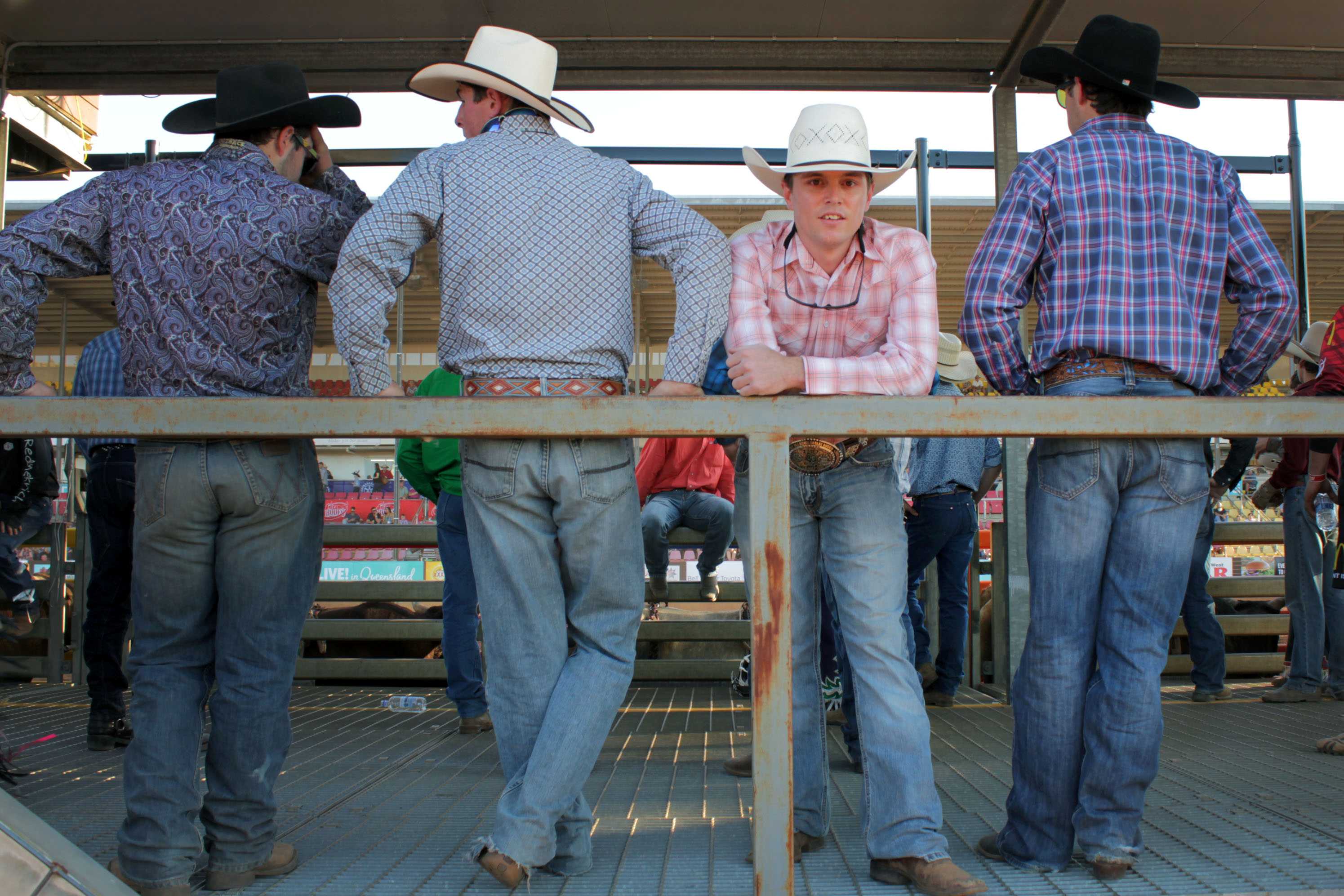 For the 2016 Open Bull Ride Champion, Jared Boghero, standing between three men all in blue jeans and wide hats.