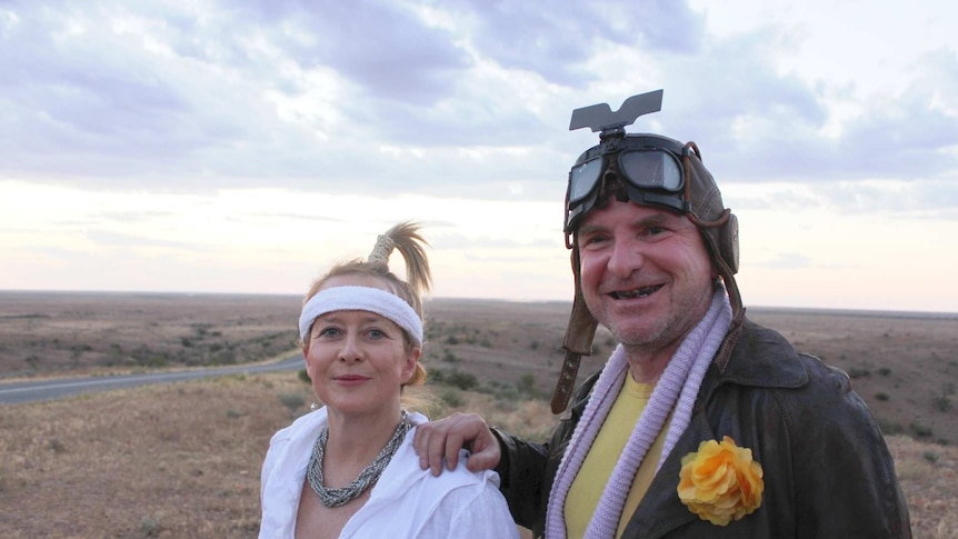 Kylie and Phil Montgomery, two Mad Max fans, dressed in the style of the film at the Mundi Mundi lookout near Silverton.