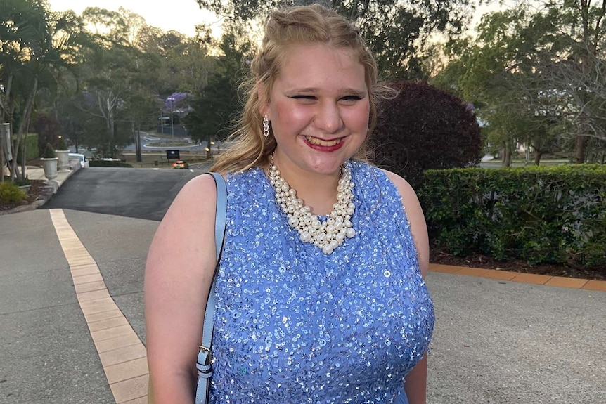 An excited high school student heading into her senior formal