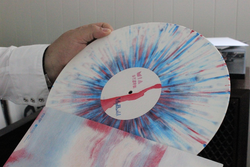 A bright pink and blue vinyl record