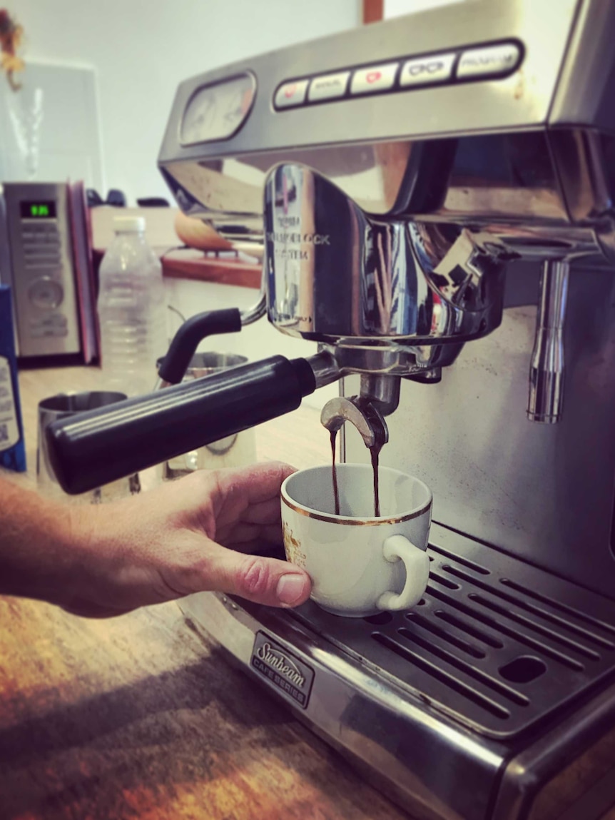 Coffee shot being poured into cup