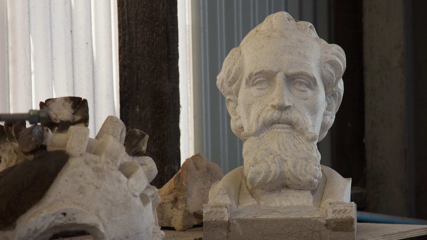 A stone bust of Charles Darwin