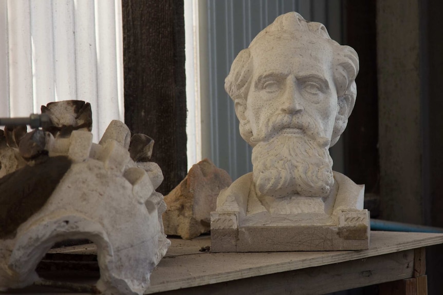 A stone bust of Charles Darwin