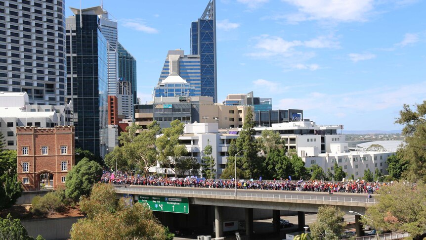Protestors cross a bridge in central Perth as they descend on parliament house. April 1, 2014.